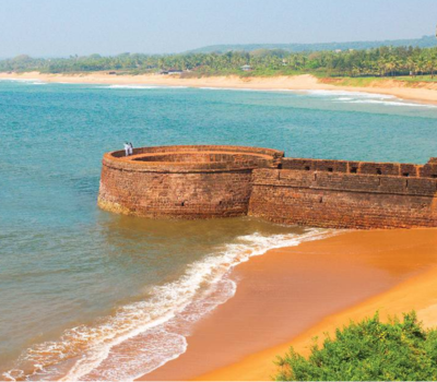Relax at Candolim Beach with a comfortable sightseeing taxi service in Goa for a peaceful beach experience